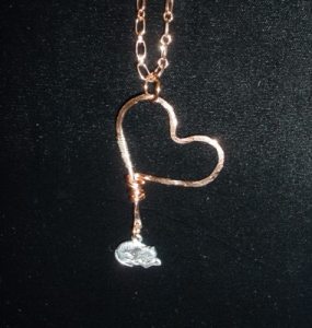 Hammered copper heart with sterling silver and sleeping kitty charm