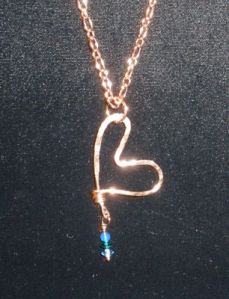 Hammered copper with blue and green crystal drop.