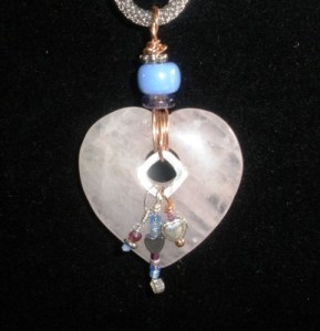 Agate heart with lampworked bead, hematite, crystal, garnet, sterling, copper,sterling silver.
