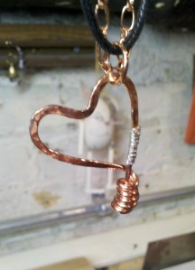 Hammered copper and fine silver.