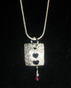 Fine silver with crystal.